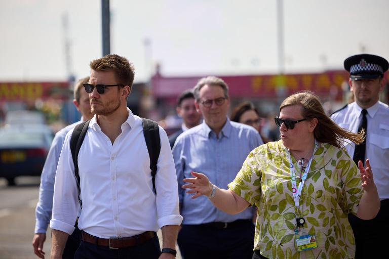 Adam Hawksbee being shown around Canvey Island.